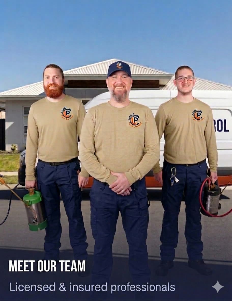 Local Pest Control team standing in front of the company van in full uniform β khaki shirts and navy pants